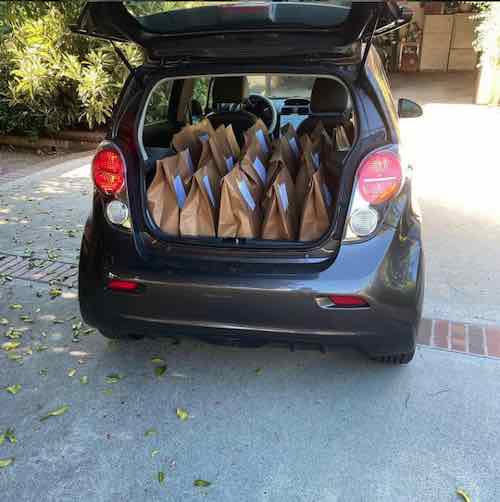 Electric delivery car filled with CSA boxes